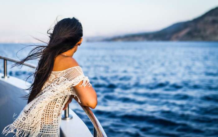 A person standing on a boat Description automatically generated with low confidence