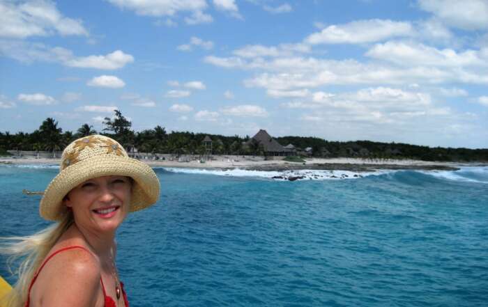 Key Differences Between the Eastern and Western Caribbean Michelle Valentine wearing hat in Caribbean