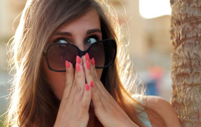 How to Plan a Surprise Trip for Your Spouse A picture containing person, person, outdoor, sunglasses Description automatically generated